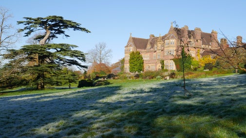 The house and frosty front garden at Knightshayes, Devon.